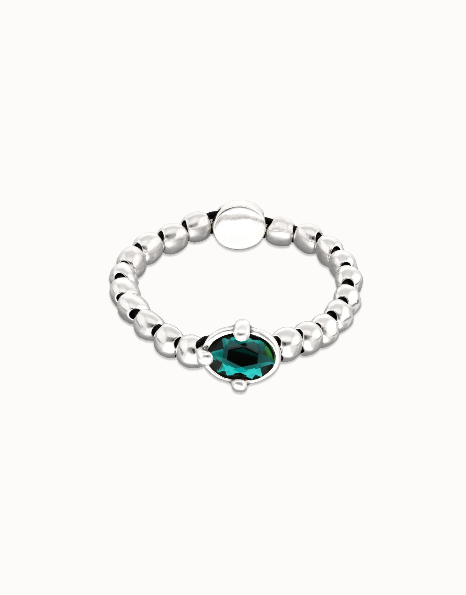Beaded bracelet with oval faceted green crystal